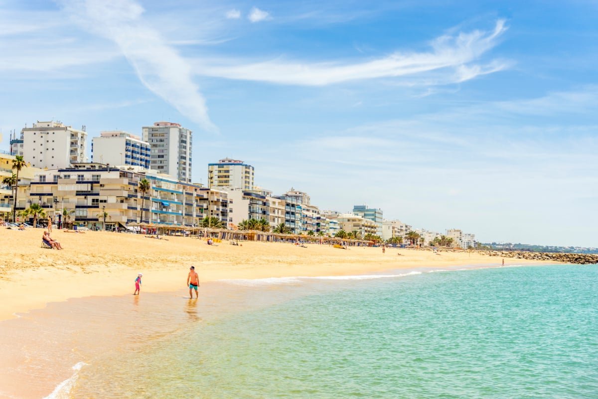 Golden beach shoreline of Quarteira, Portugal